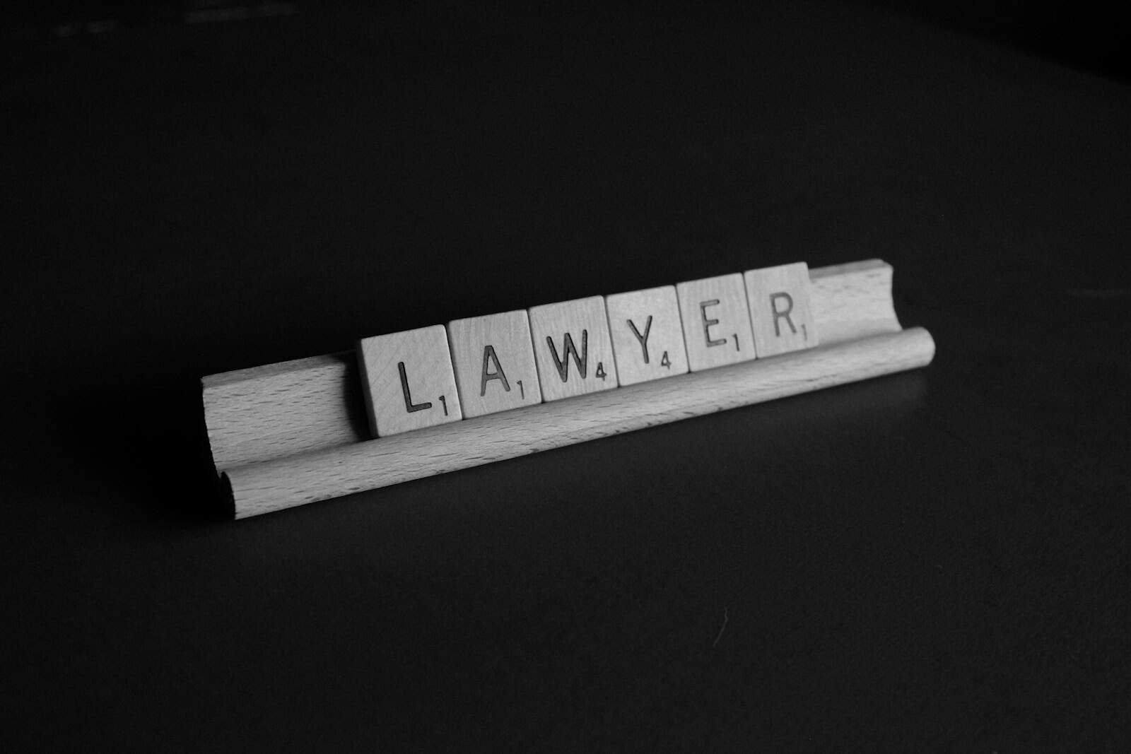 Why the Latest AI Training Data Lawsuit Could Change Everything for Creatives 2 brown wooden scrable, AI training data lawsuit.