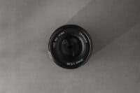 7artisans vintage lens - a black and white photo of a camera lens
