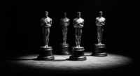 Anchor the critique in Oscar history with archival imagery of the ceremony and statuette.