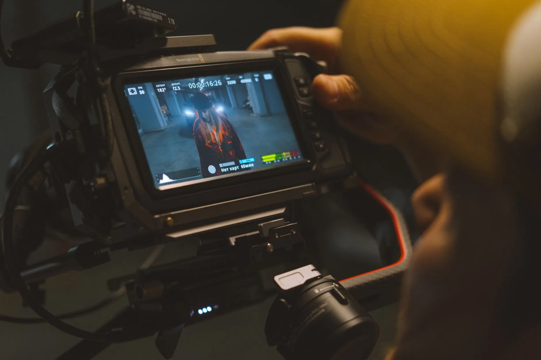 Budget AI Movies: Hidden Costs 7 Capturing a cinematic scene with professional video camera equipment indoors.