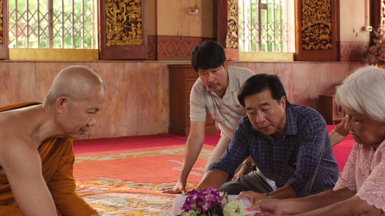 9 Temples to Heaven: Why This Film Breaks Every Movie Rule 5 A monk receives the family offering inside a temple in 9 Temples to Heaven