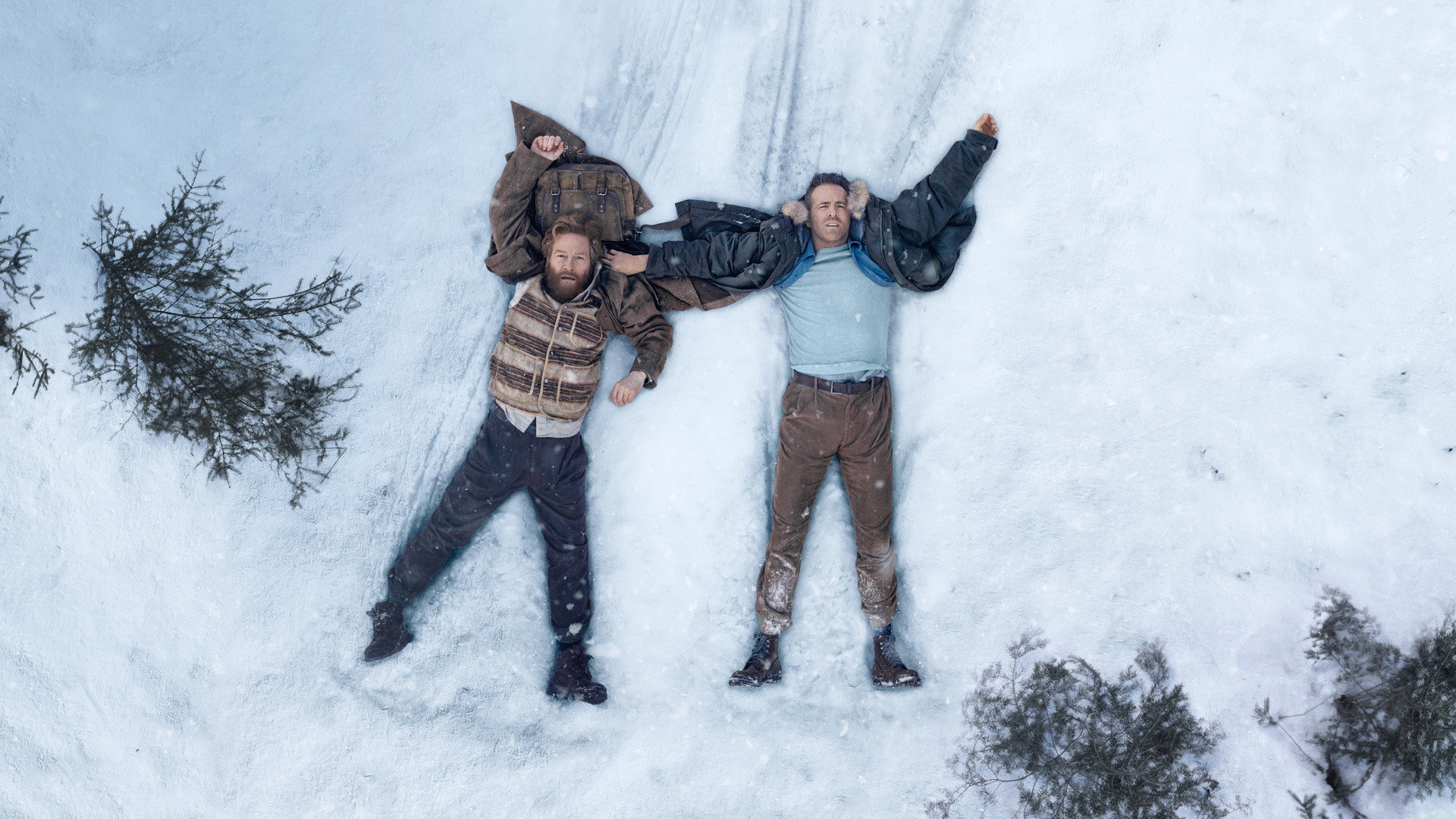 Mayday: Reynolds and Branagh Are the Best Duo of the Year 7 Ryan Reynolds and Kenneth Branagh lying in the snow in Mayday