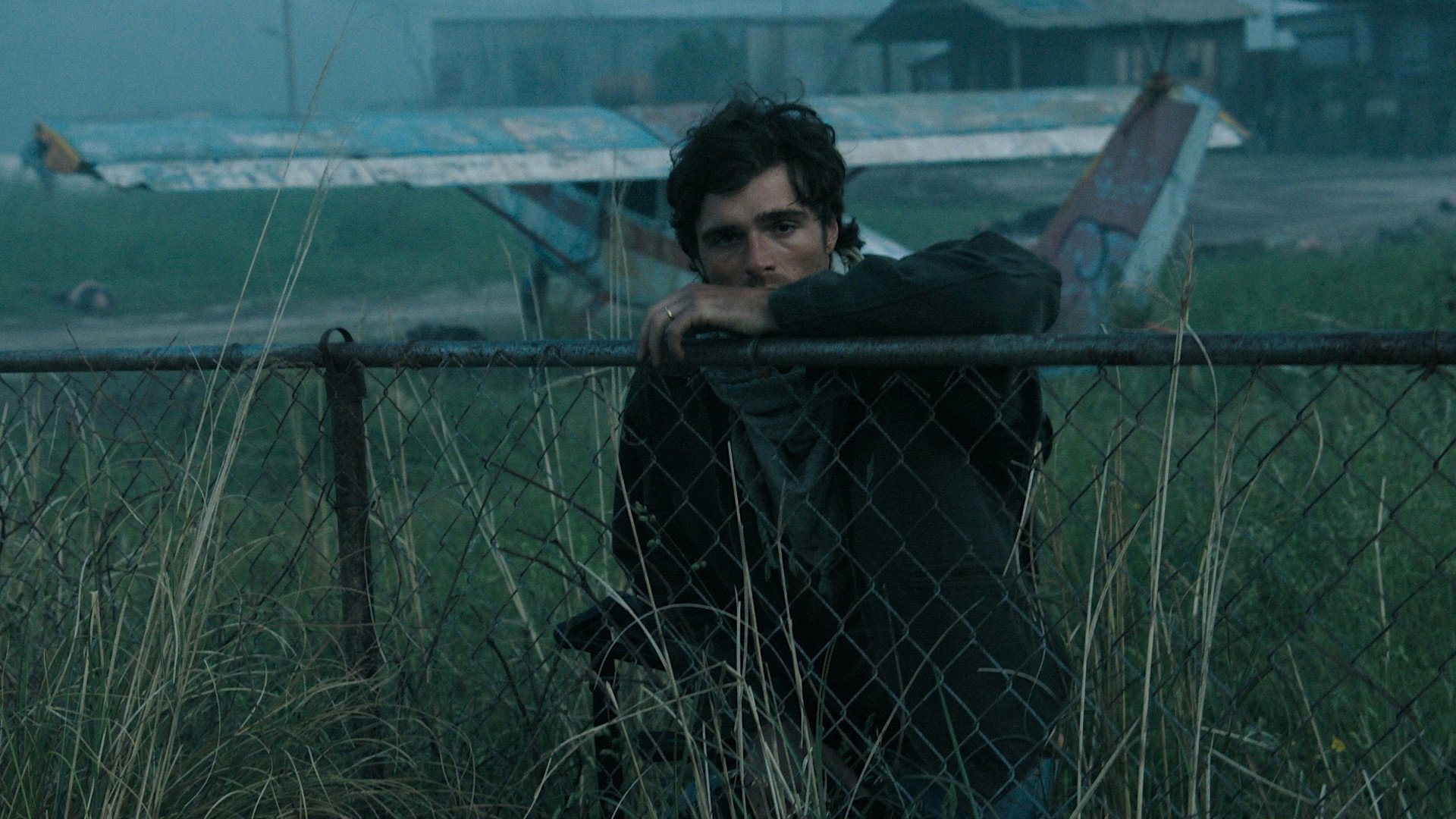 The Dog Stars: Ridley Scott at His Most Personal 7 Jacob Elordi as Hig beside a wrecked airfield in Ridley Scott The Dog Stars