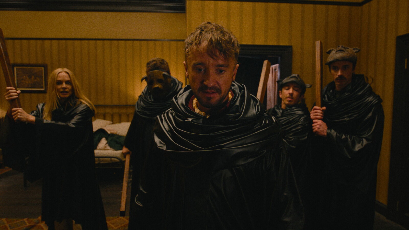Robed cult members gather around Tom Felton in They Will Kill You